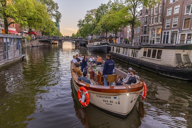 Amsterdam 2 Hour Small-Group Canal Cruise with Dutch Snacks & Bar - Anne Frank House and Westerkerk from the water