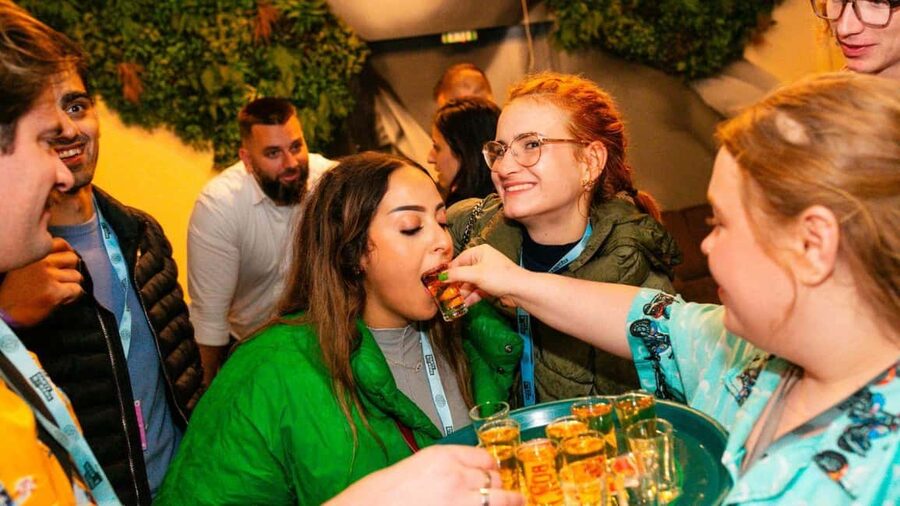 Budapest: Unmissable Bar Crawls with Shots & VIP Club Entry - Walking through central Budapest after dark
