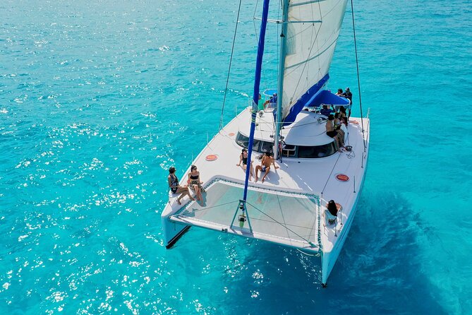 Discover Isla Mujeres: Catamaran, Snorkeling, and "Ice Bar" - Boarding the catamaran and settling into the open bar