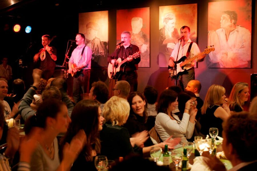 Dublin: Irish Night Show at the Merry Ploughboy Pub - Communal tables and the three-course meal