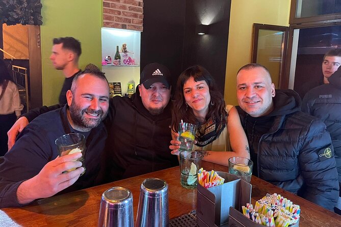 Fun Explorers Pub Crawl with free welcome shots and free ent - Starting under the orange umbrella in Krakow