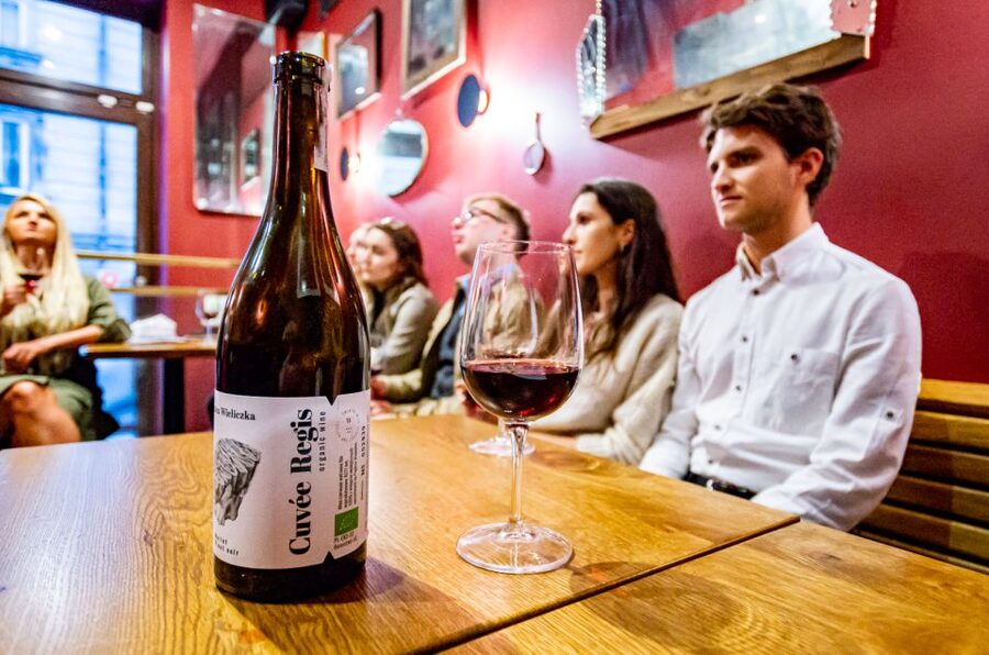 Krakow: Guided Wine Bar Tour with Tastings and Snacks - Walking through Krakow’s Old Town between tastings
