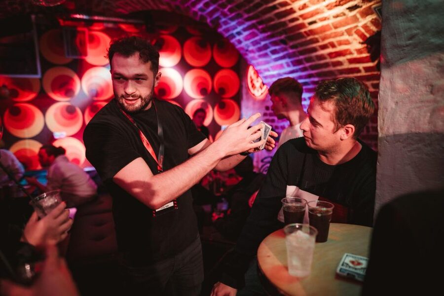Krakow: Pub Crawl with 1 Hour of Unlimited Alcoholic Drinks - A magic show gives the opening stop some variety