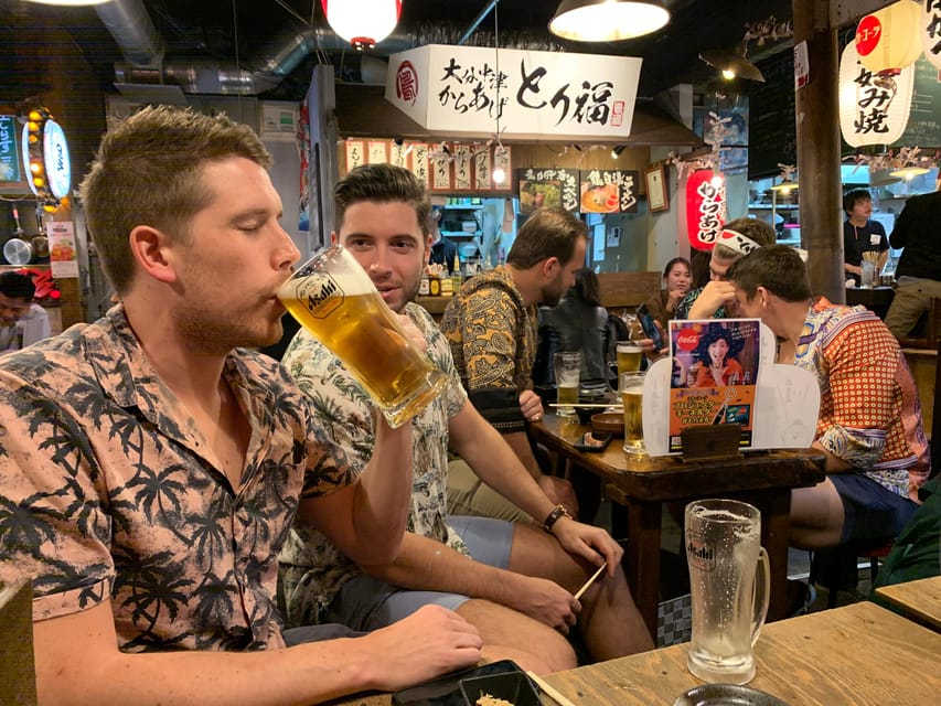Osaka: Deep Food Tour and Bar Hopping in Namba - Starting under the neon near Osaka Shochikuza