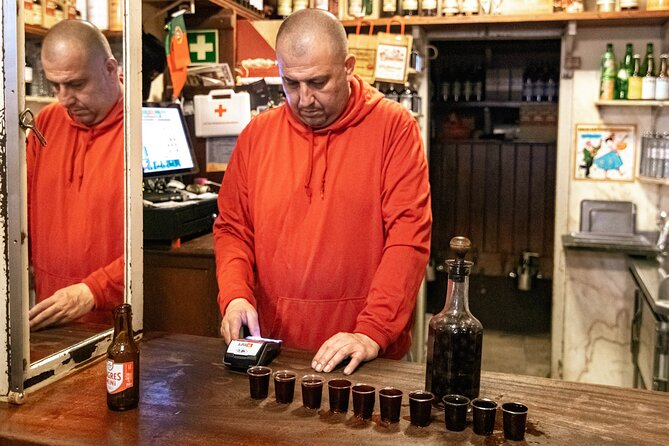 Private Night Bar Crawl in Lisbon with Local Guide and Drinks - Moving into Bairro Alto after dark