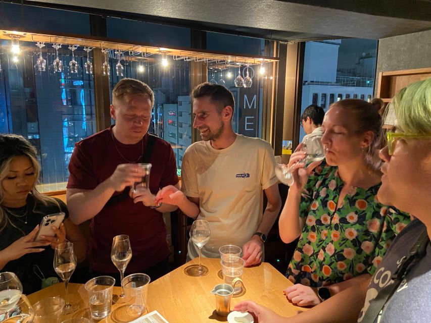 Shinjuku: bar hopping night tour at Japanese Izakaya - Kabukicho, neon signs, and local warnings