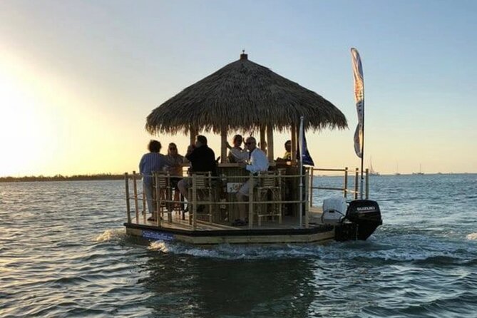 Tiki Boat - Downtown Tampa - The Only Authentic Floating Tiki Bar - A floating tiki bar with Tampa as the backdrop
